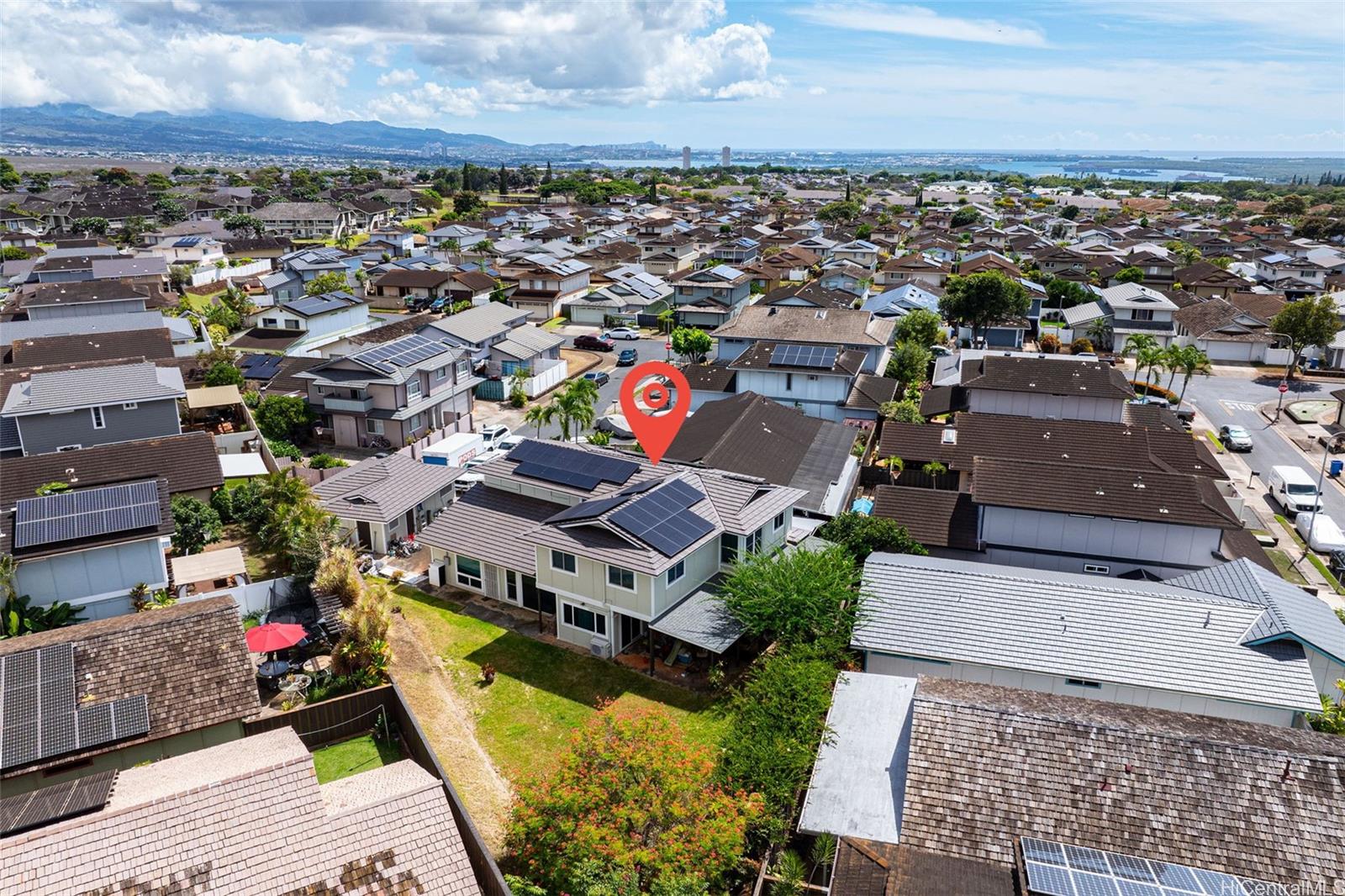 an aerial view of a house with a ocean view