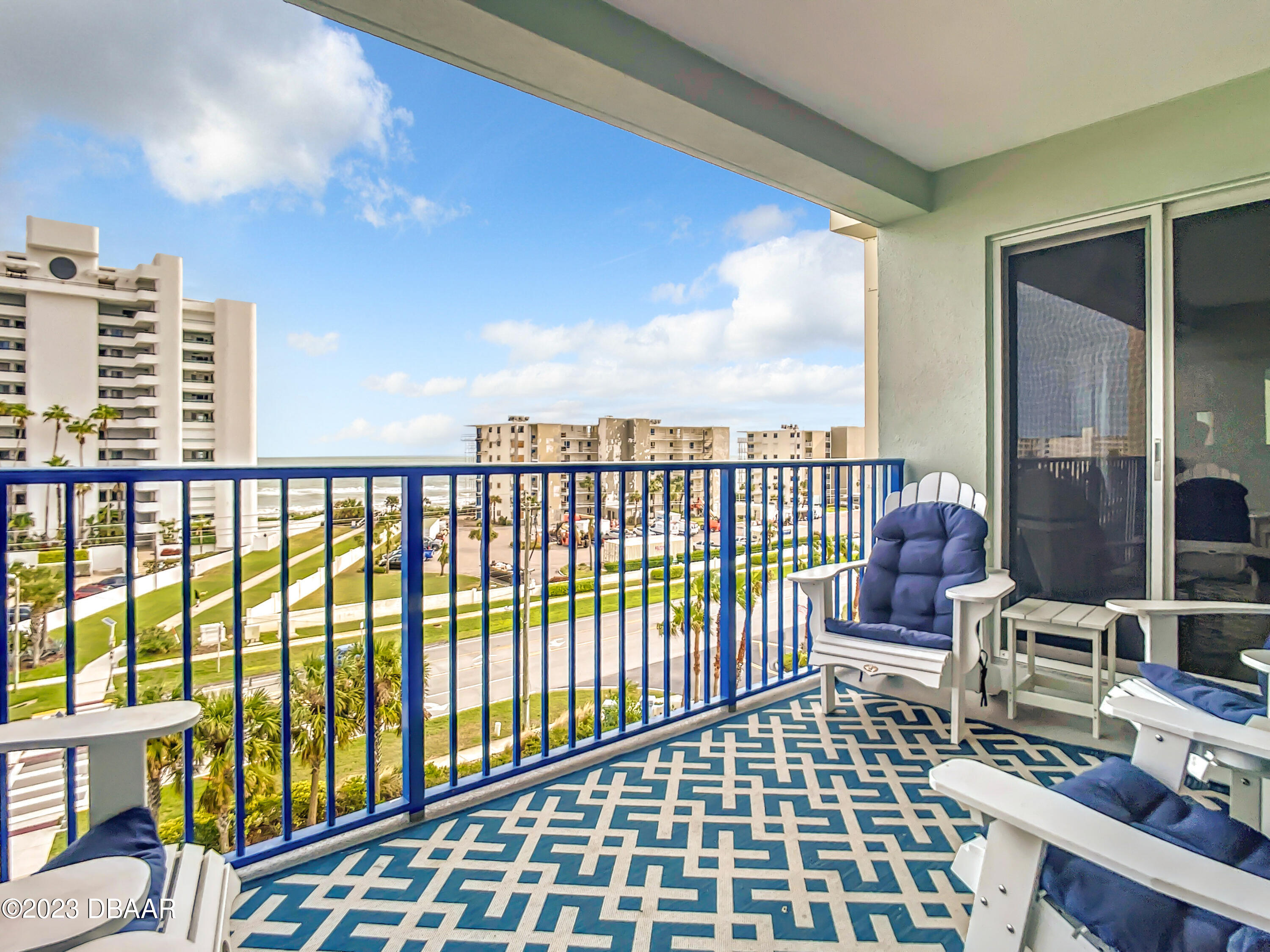 a view of balcony with wooden floor