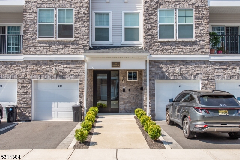 a front view of a house with garage