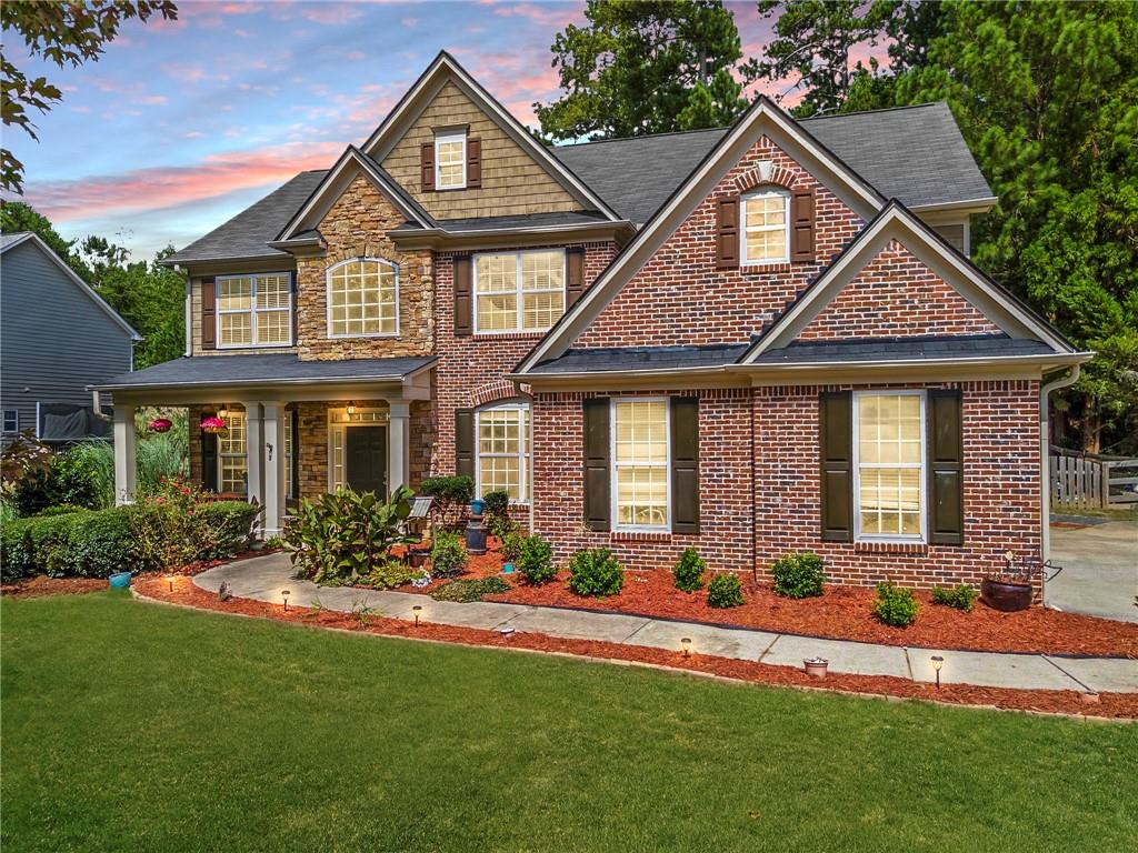 a front view of a house with a yard