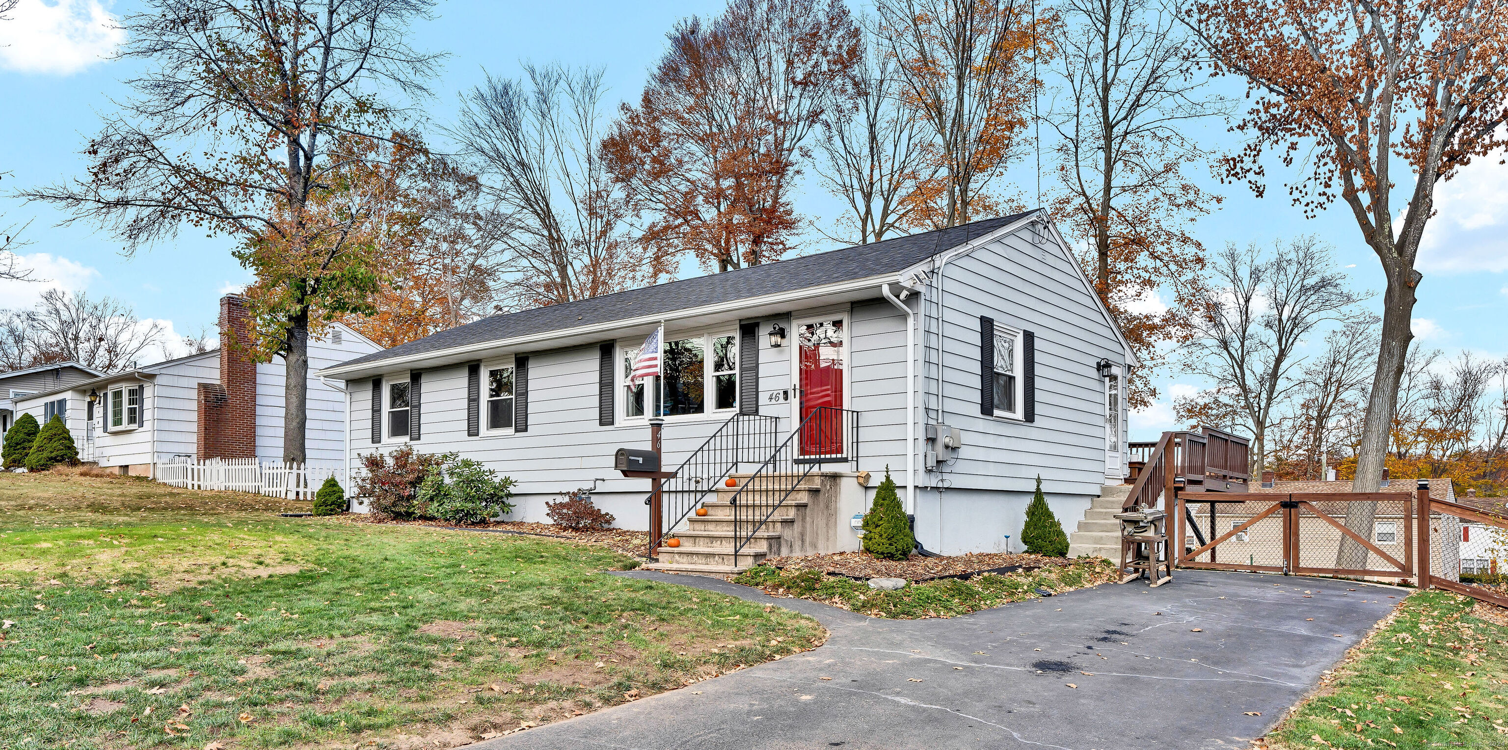 a front view of house with yard and seating area