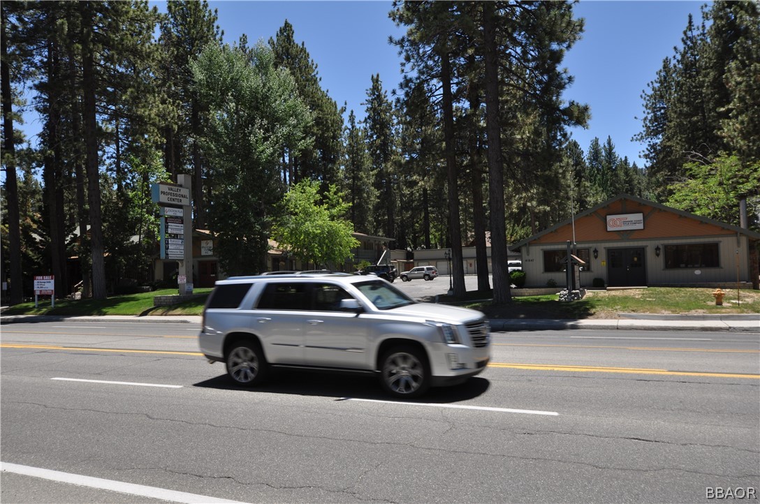 a view of a car parked in front of a house