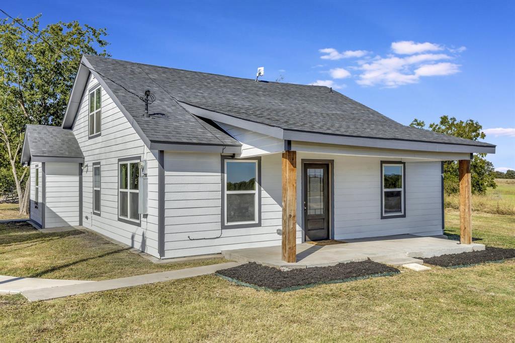 a front view of a house with a porch