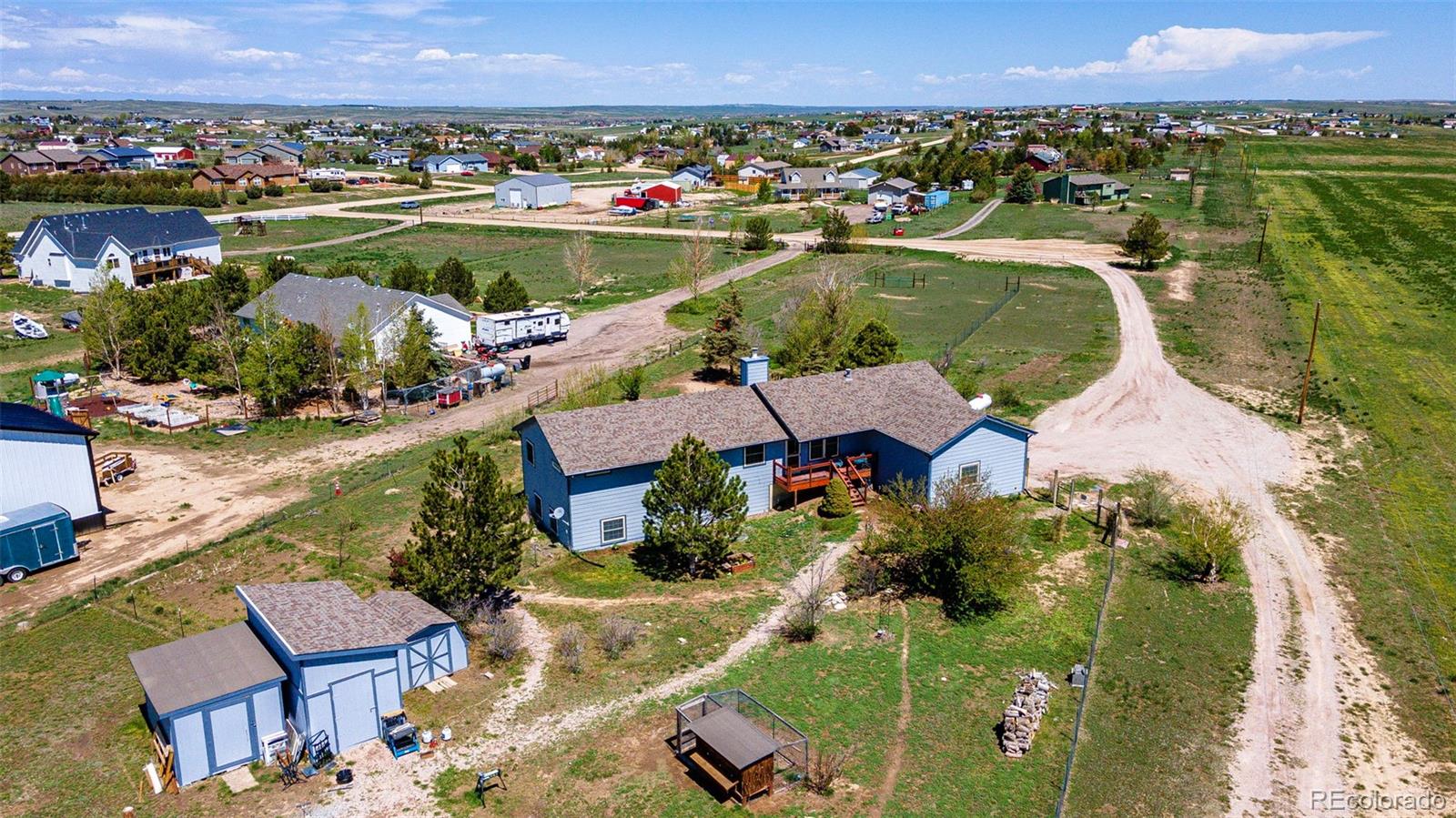 an aerial view of a house with a lake view