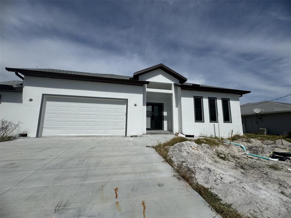 a view of house and garage