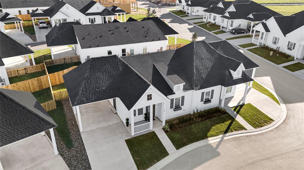 an aerial view of a house with outdoor space