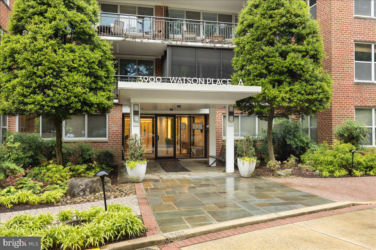 a view of a building with sitting area