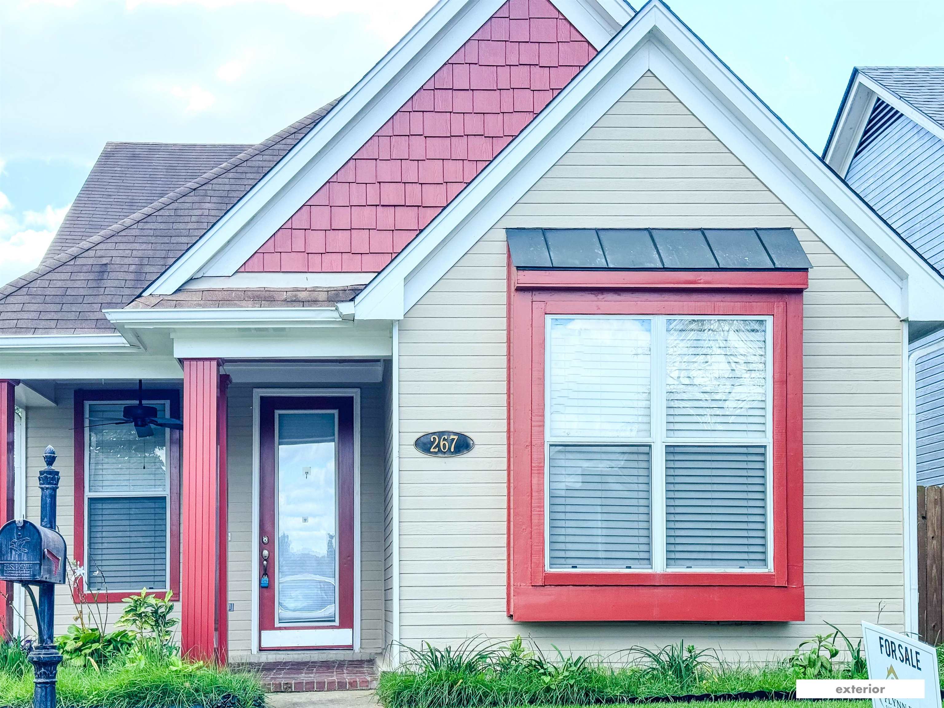 a front view of a house with garage