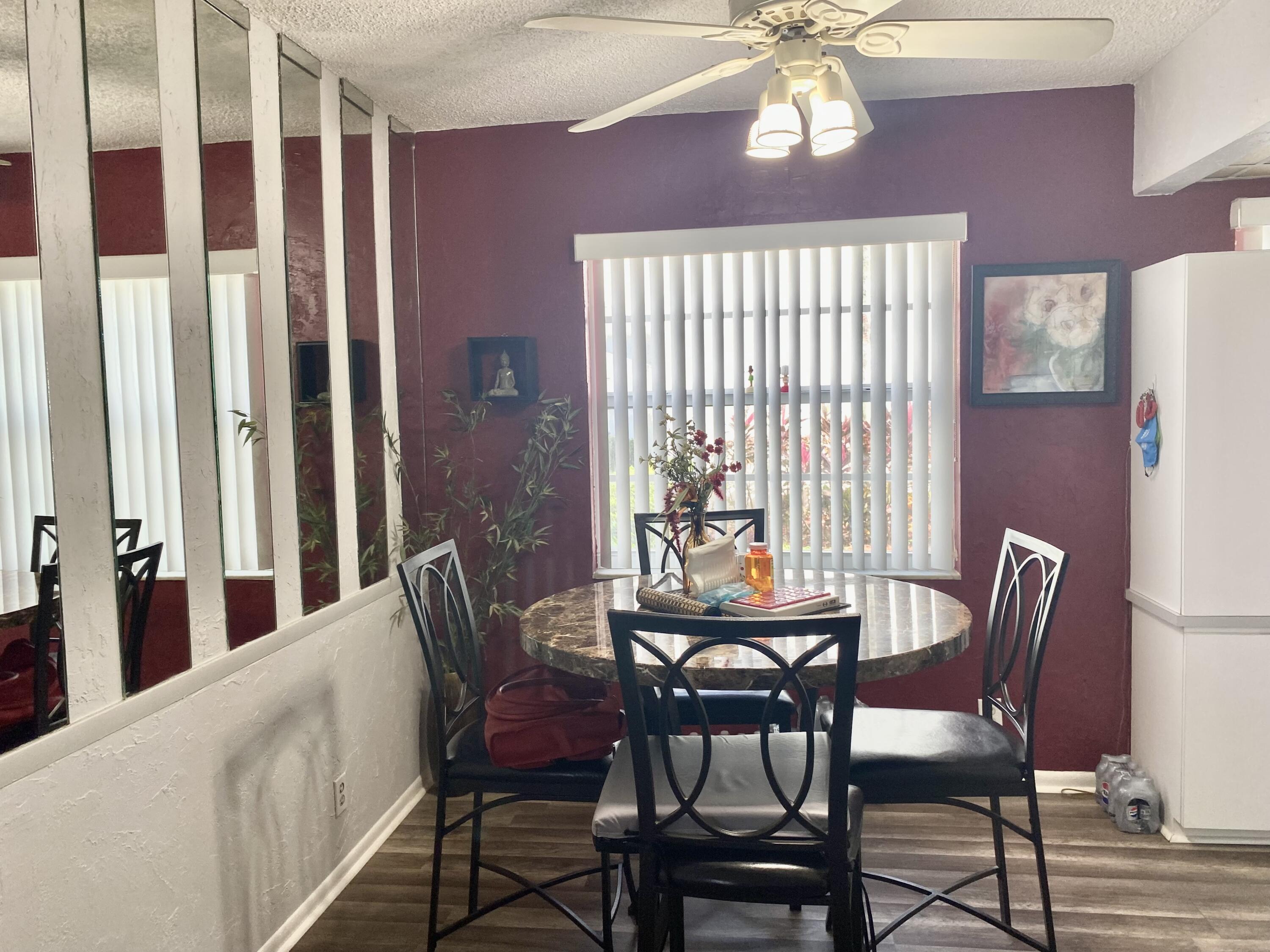 a dining room with furniture and window