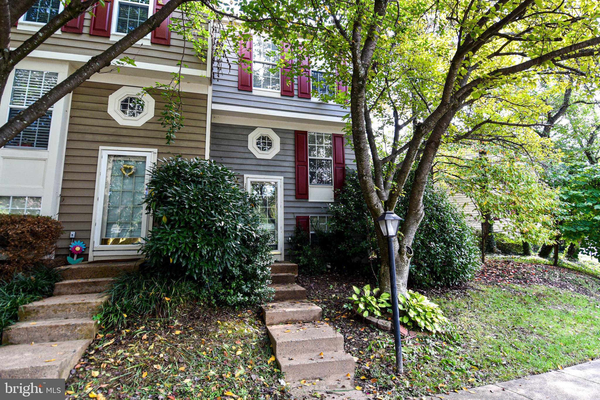 a view of a house with a yard and plants