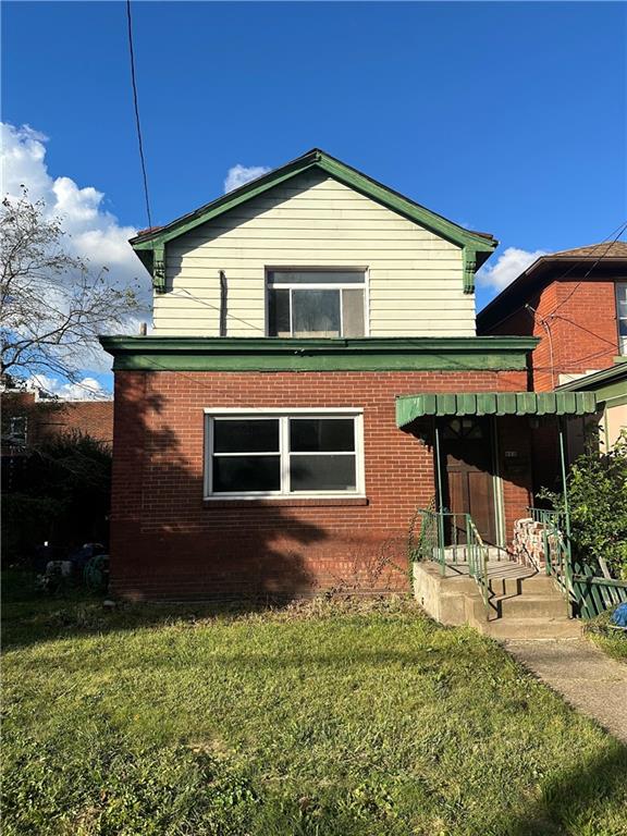 a front view of a house with a yard