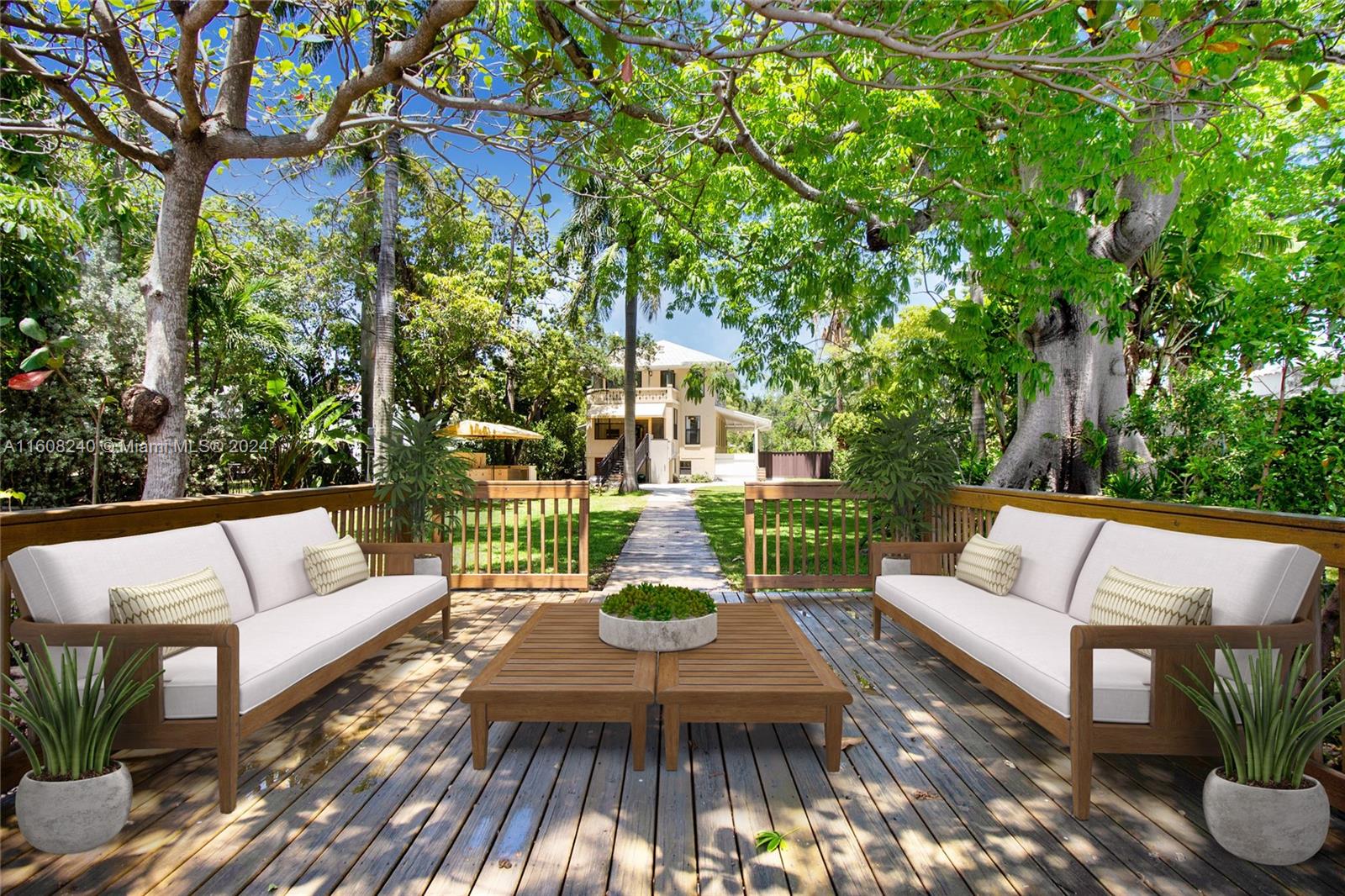 a view of a patio with couches table and chairs and potted plants