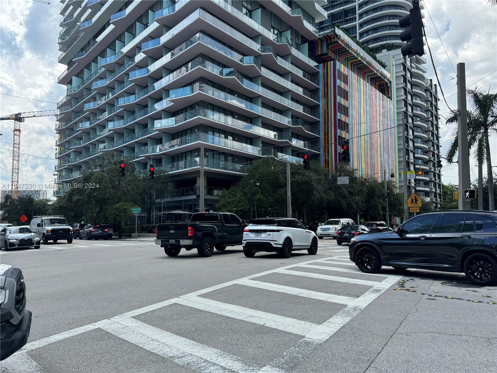 a view of street with parked cars