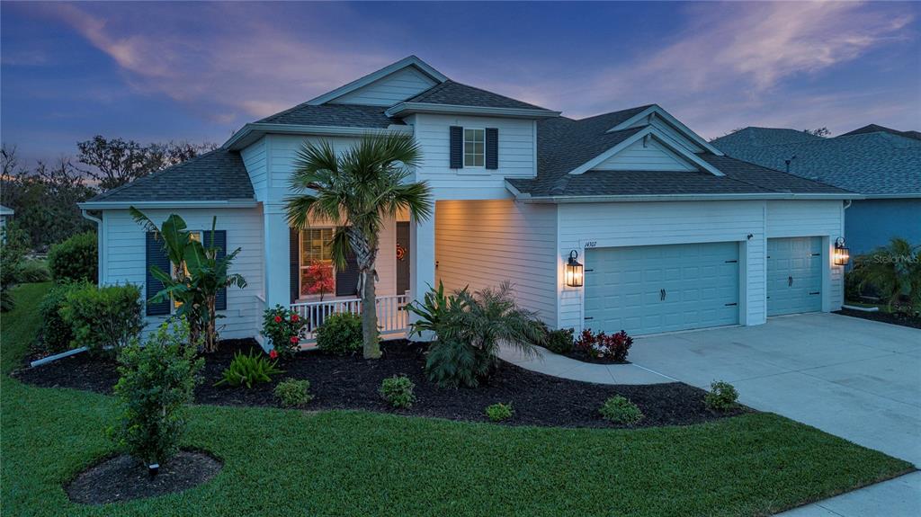 a front view of a house with a garden