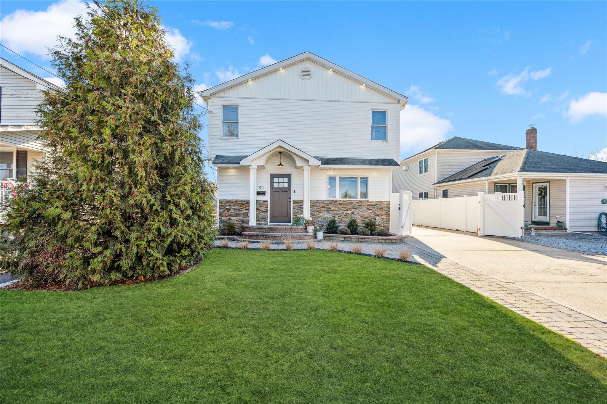 View of front of house with a front lawn