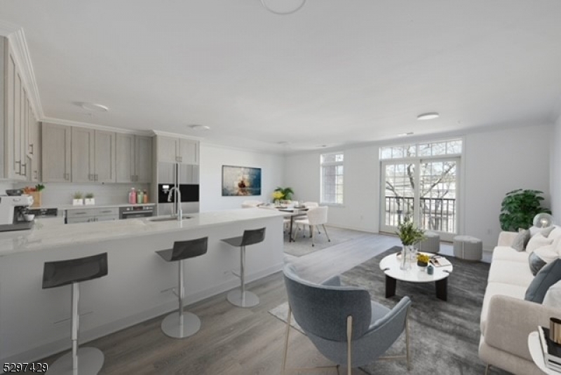 a living room with furniture a dining table and chairs