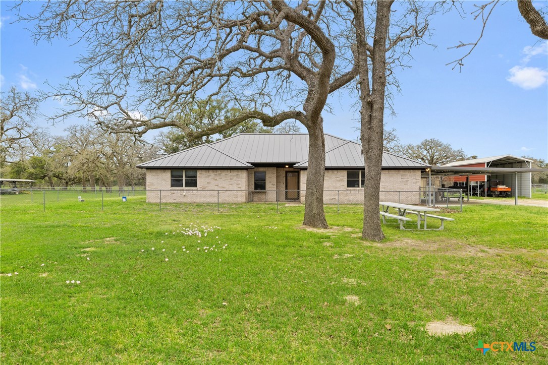 a house view with a garden space