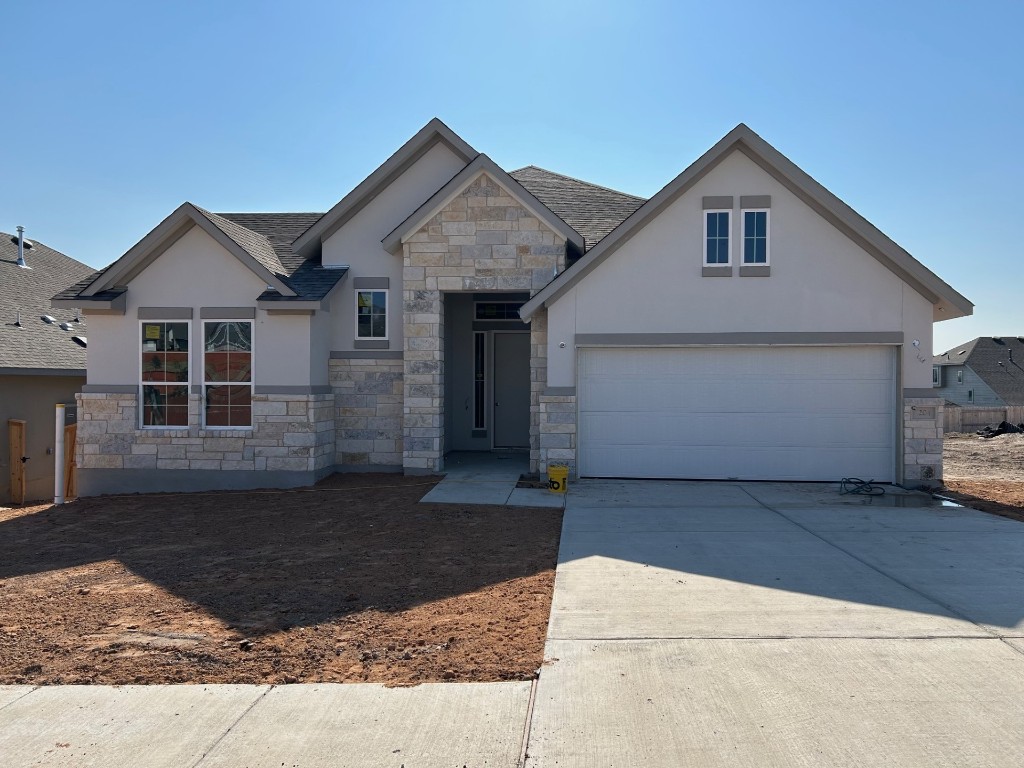 a front view of a house with a garage