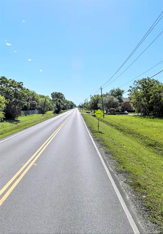 a view of a road and a yard