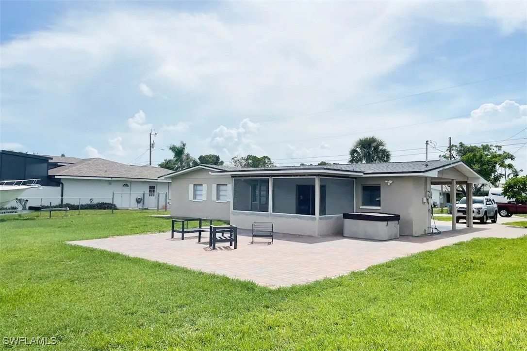 a front view of house with a garden and patio