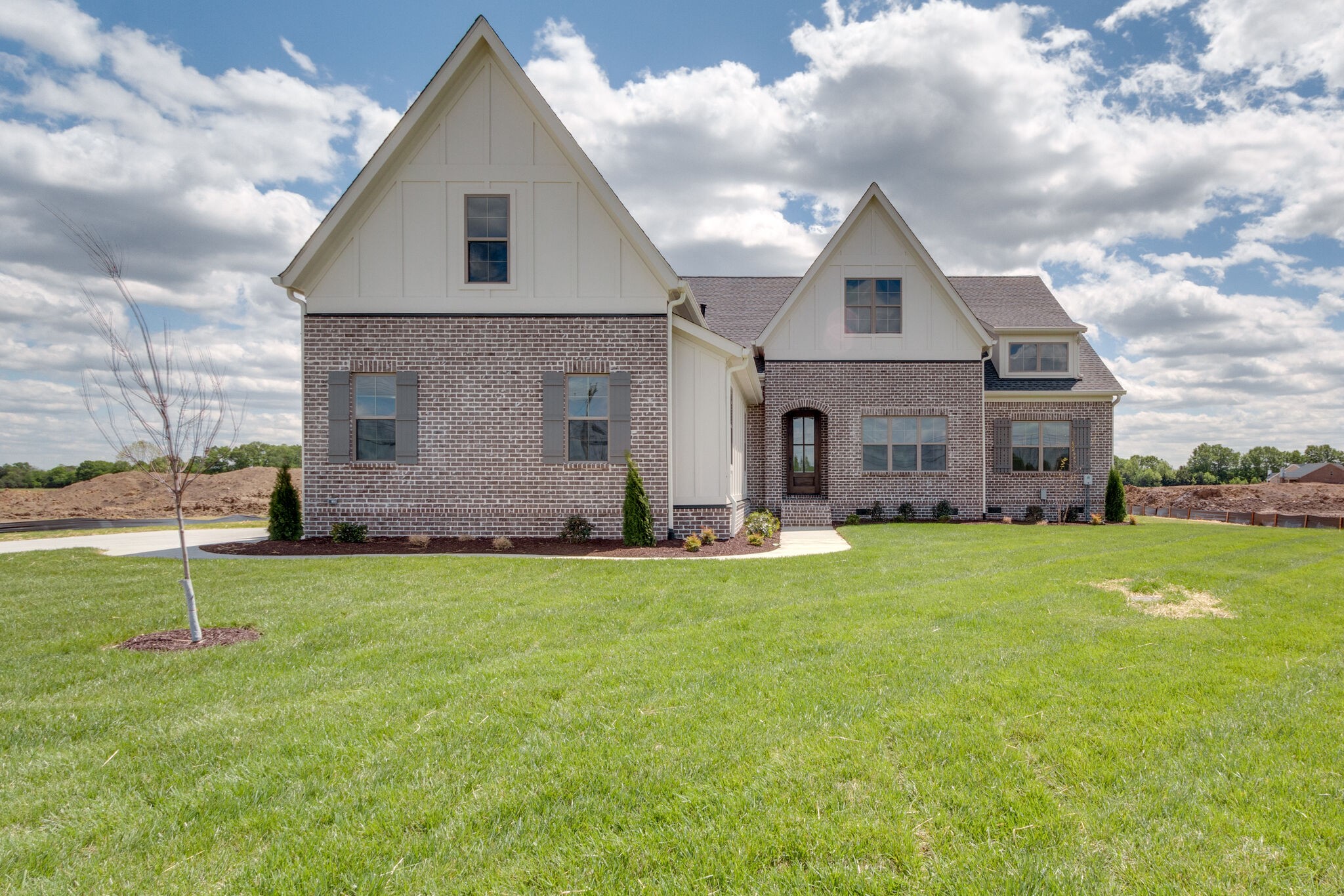 a front view of house with yard and green space