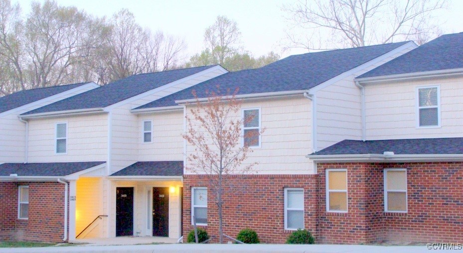 a front view of a house with large windows