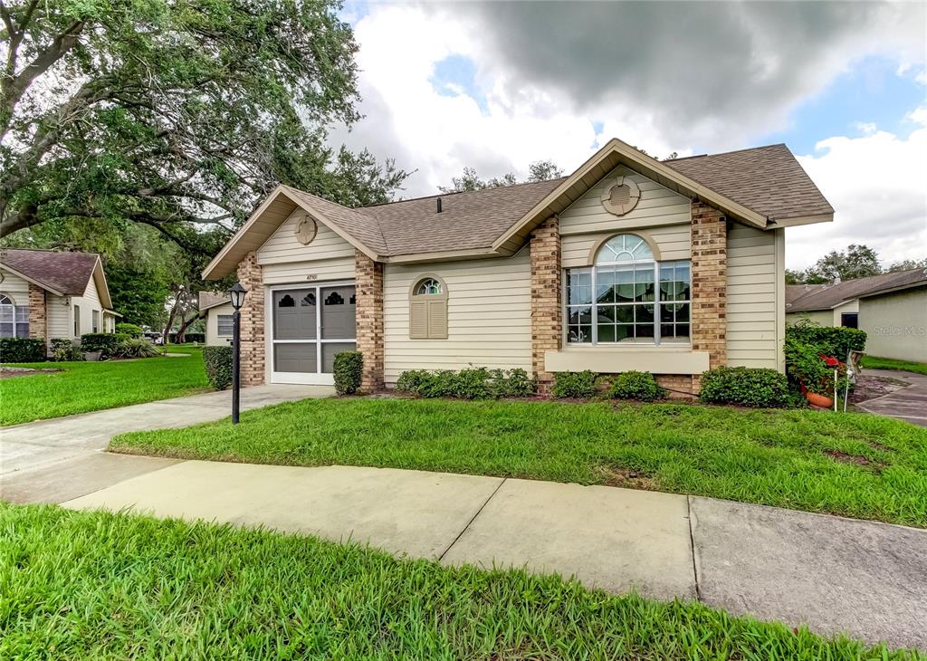 a view of a house with a yard