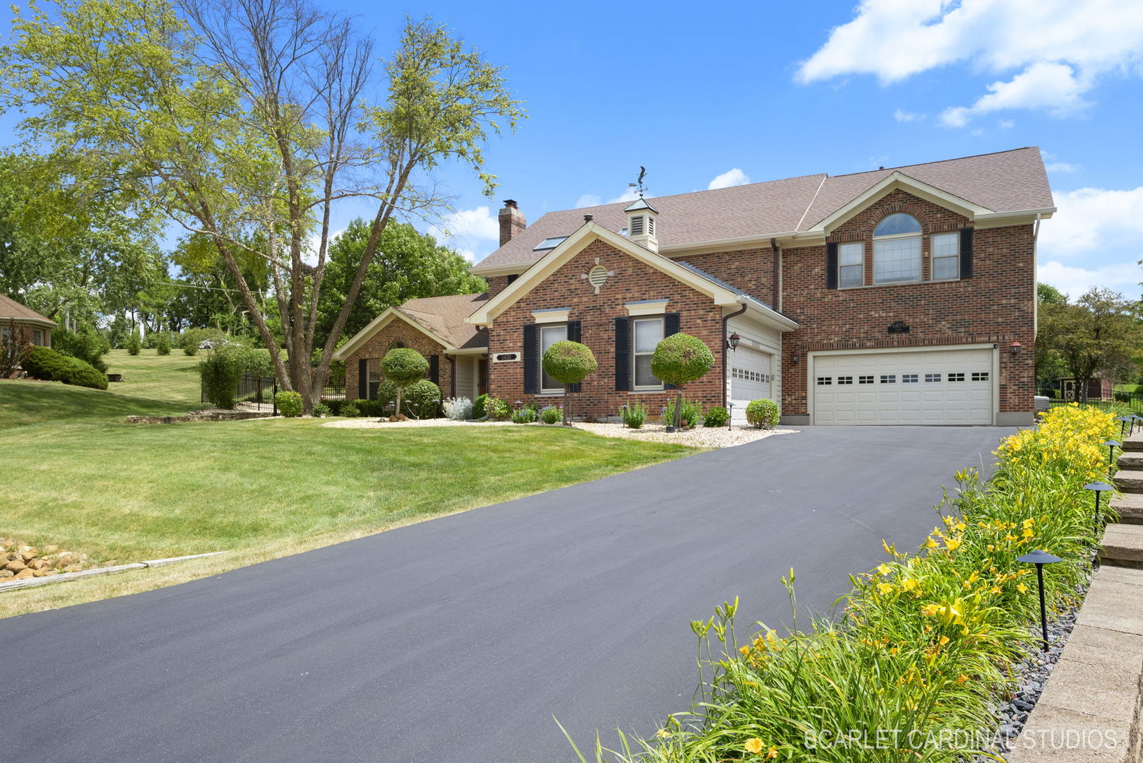 a front view of house with yard and green space