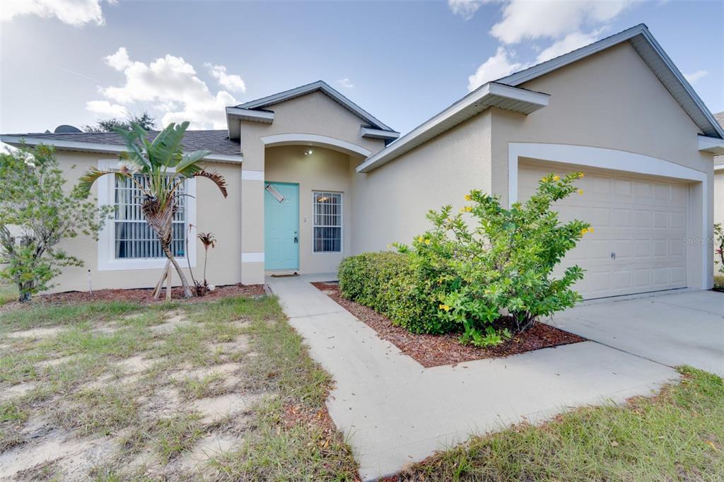 front view of a house with a yard