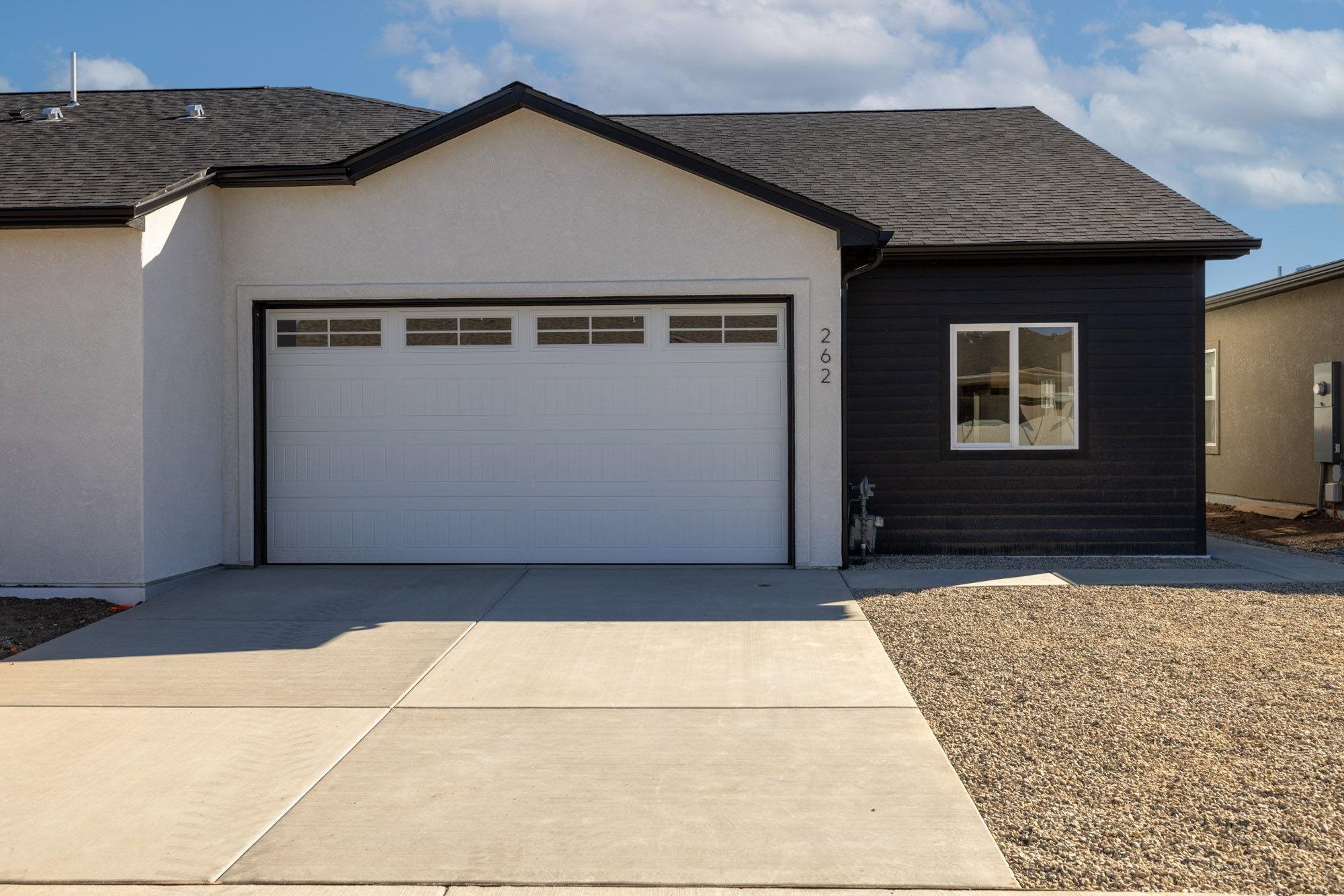 a front view of a house with a garage