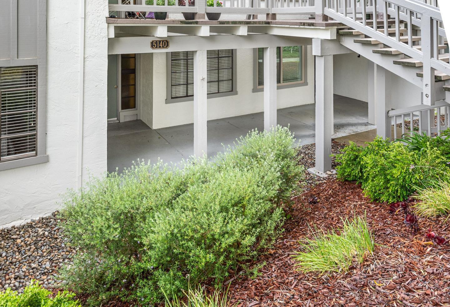 a view of a building with a garden