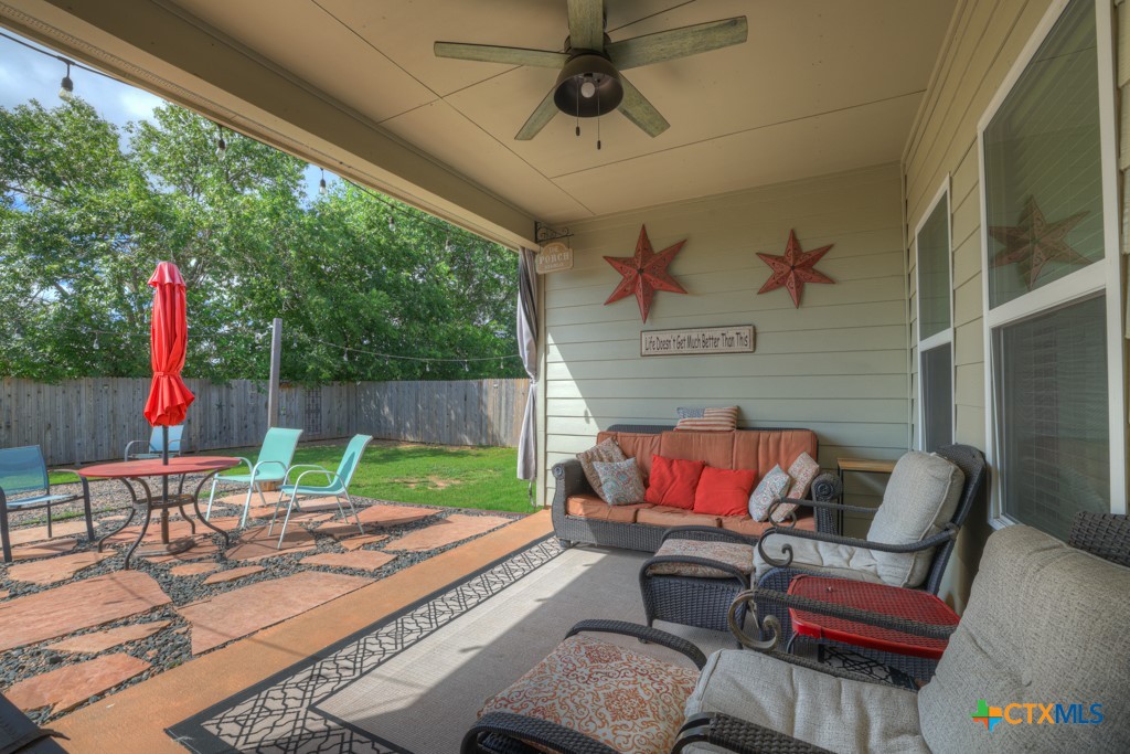 a patio with a table and chairs