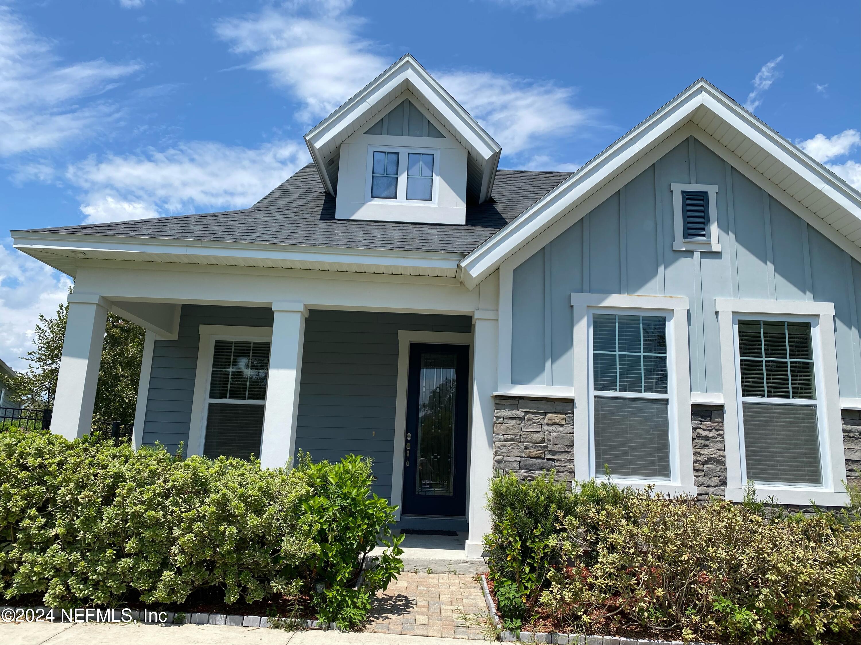 front view of a house with a yard