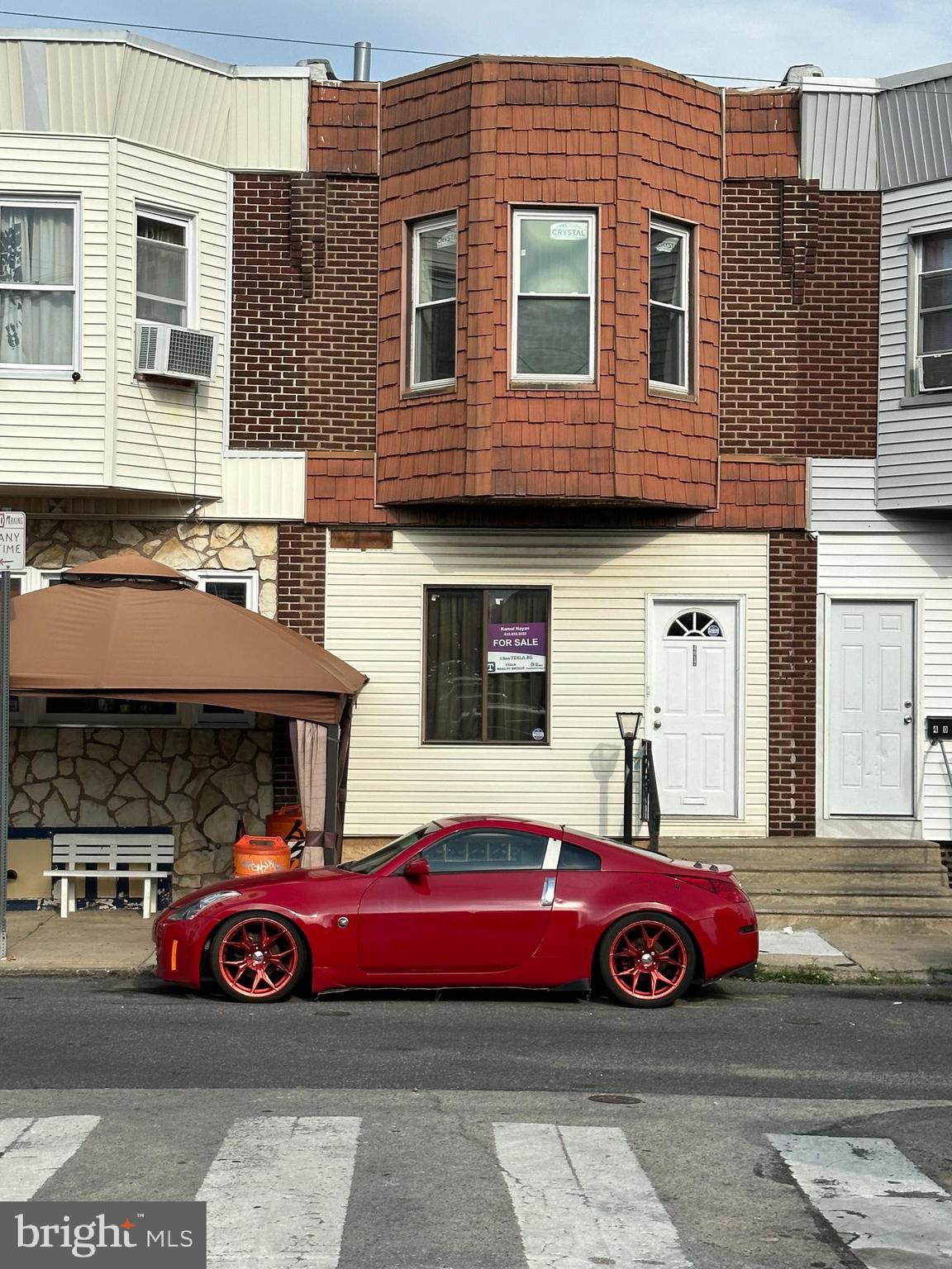 a front view of a house with parking