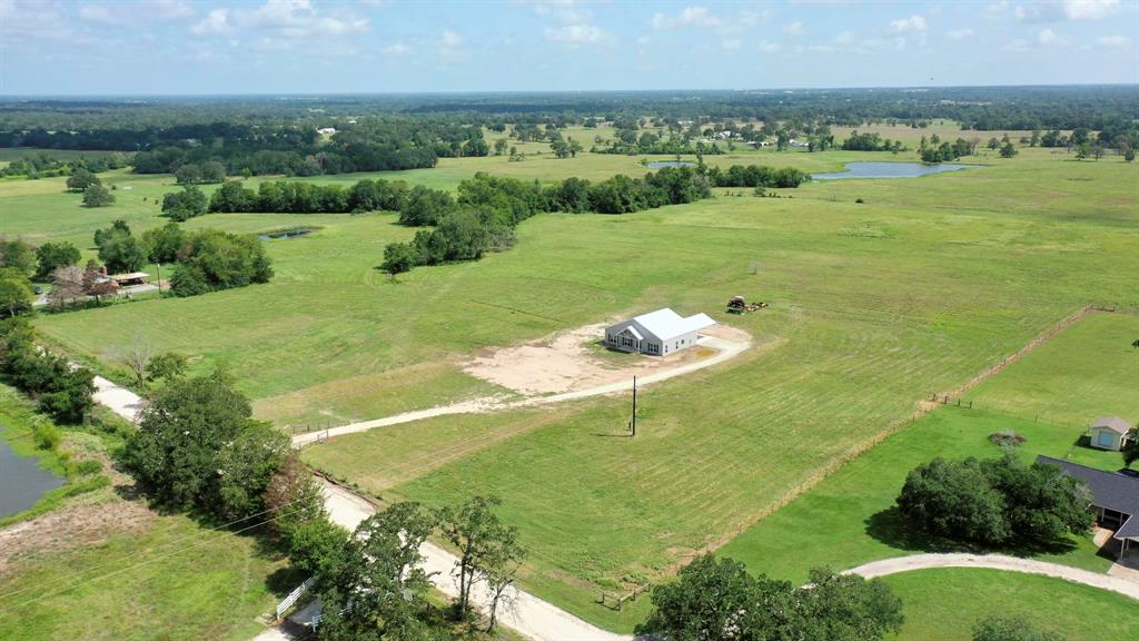 a view of a lake with a yard