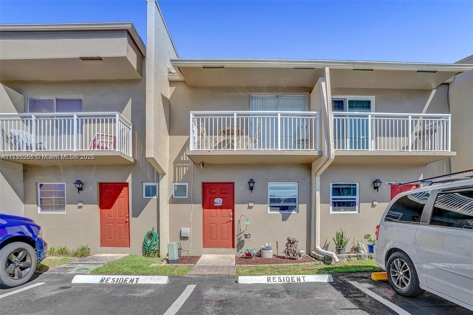 a front view of a house with parking area