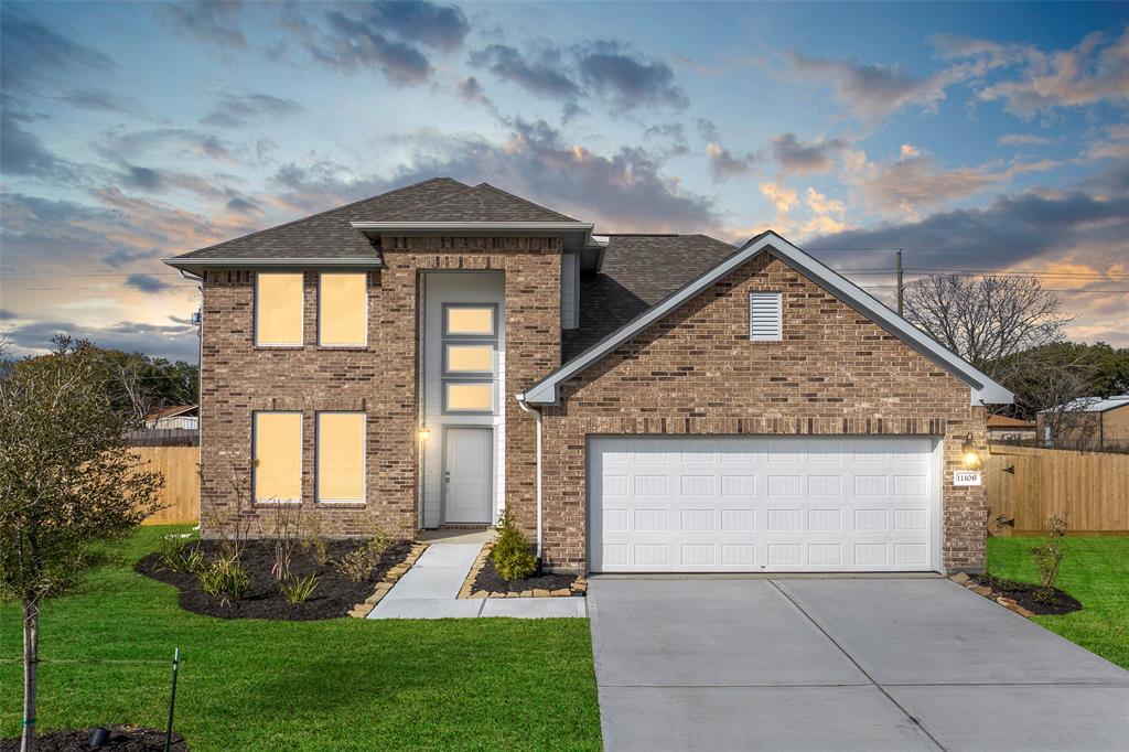 a front view of a house with a yard