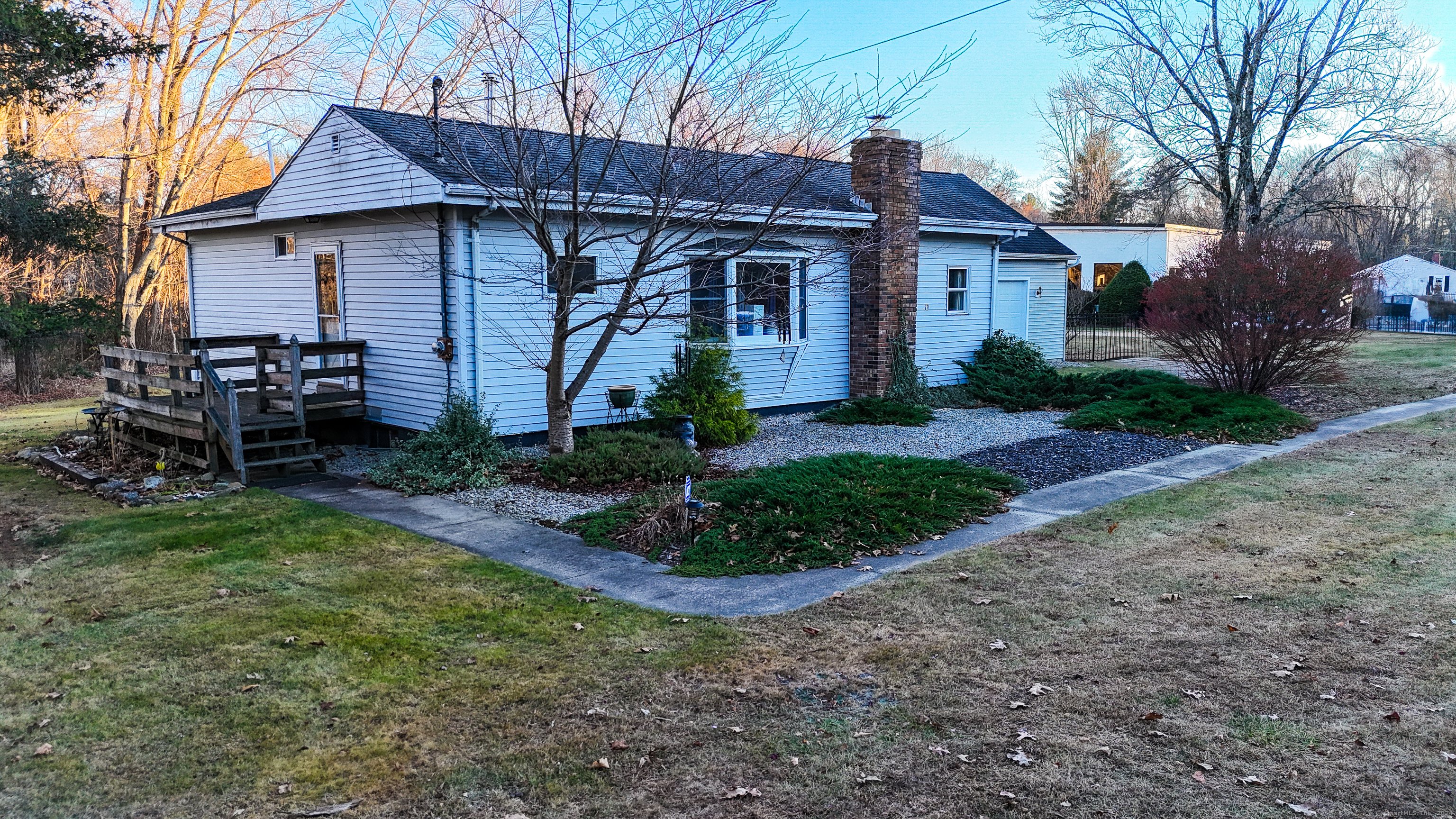 a front view of a house with garden