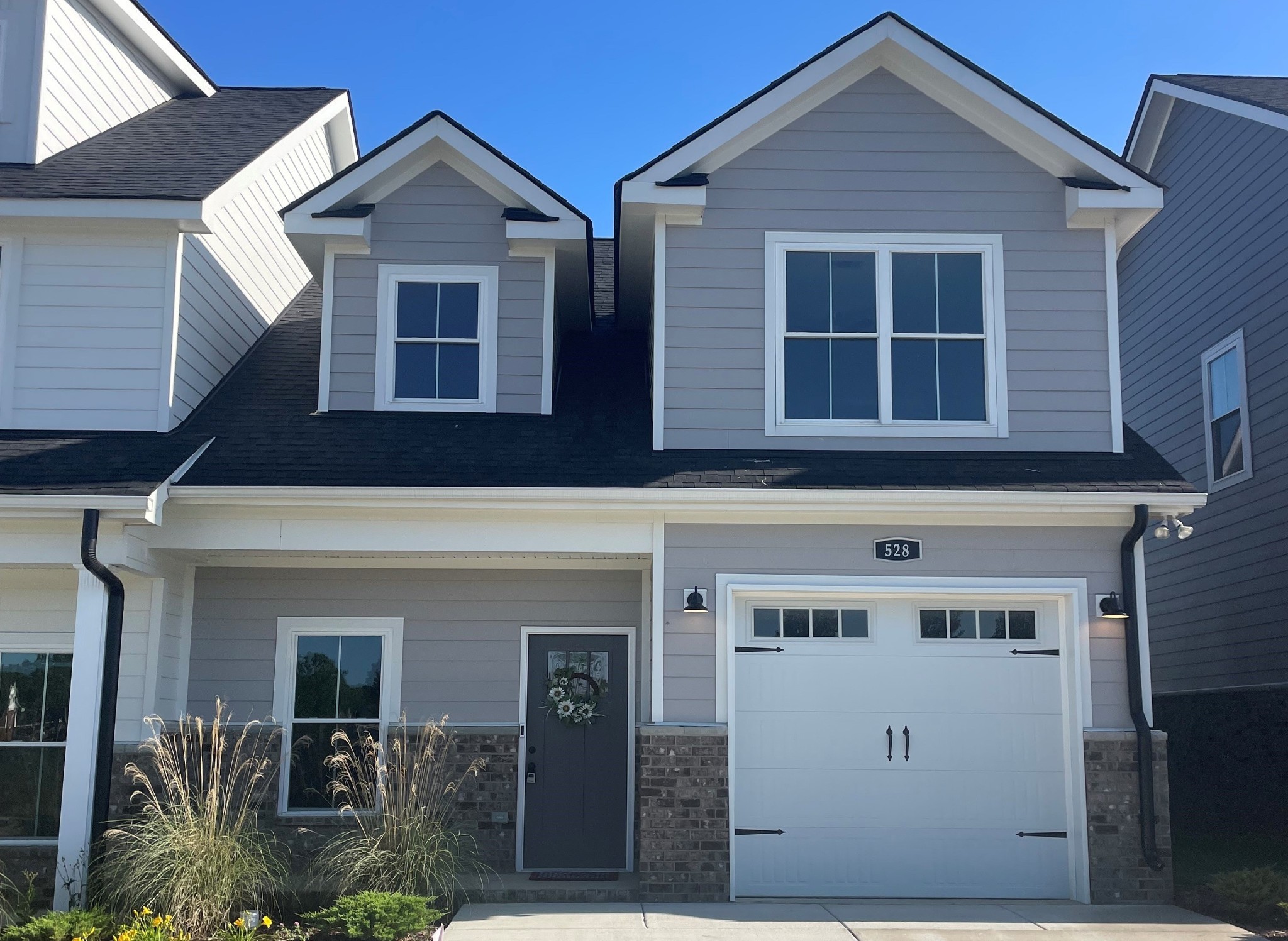 a front view of a house with a yard