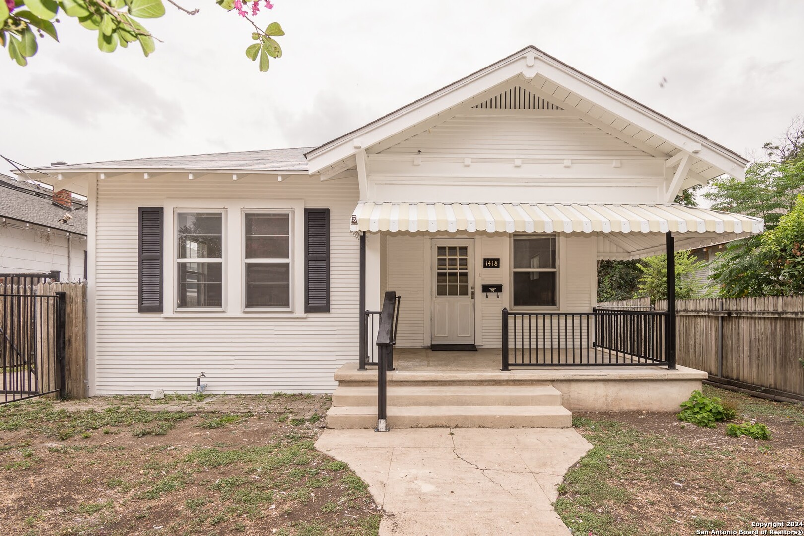 a front view of a house with a porch