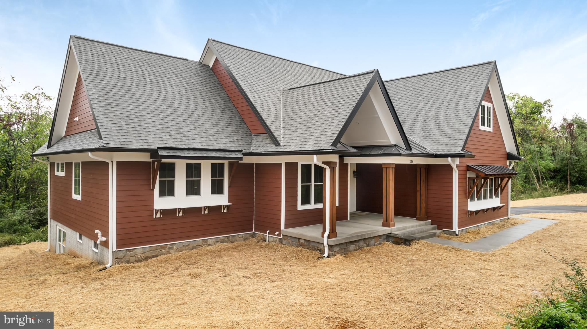 a house with trees in the background