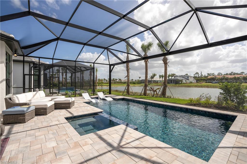 a view of swimming pool with outdoor seating