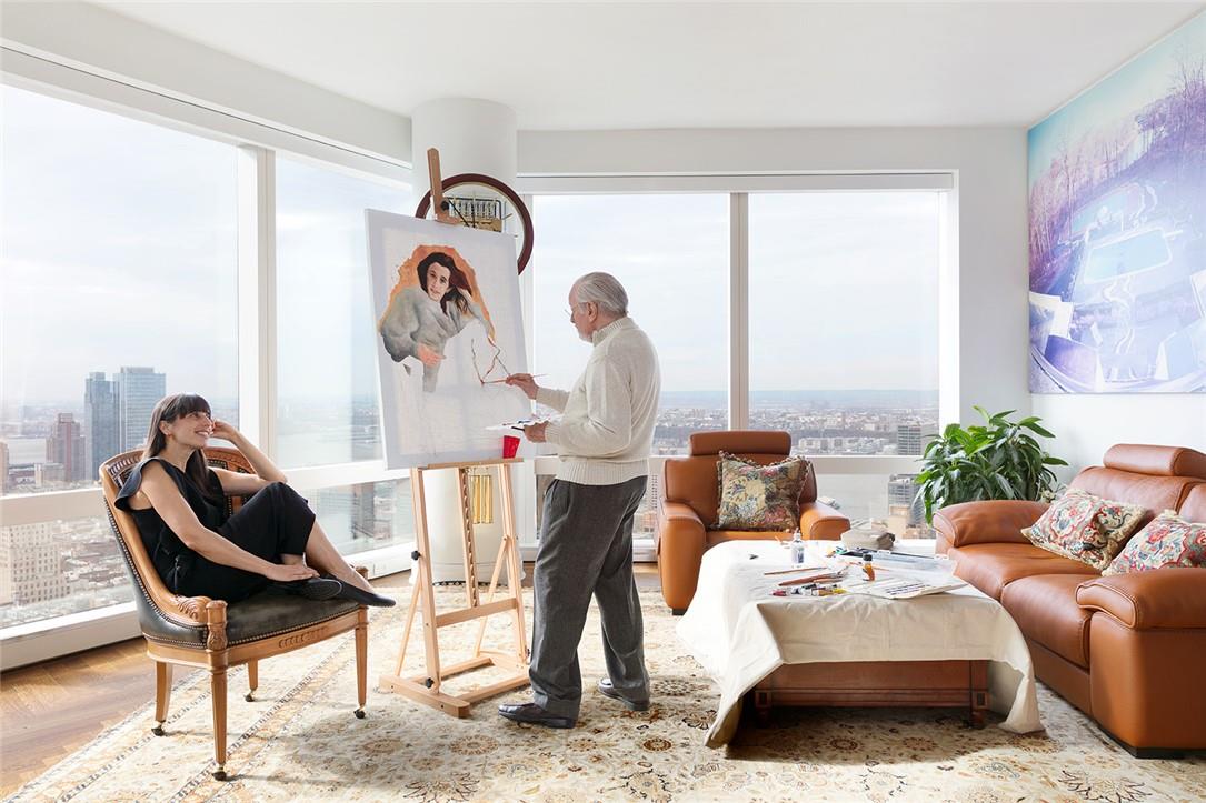 a living room with furniture and a mirror