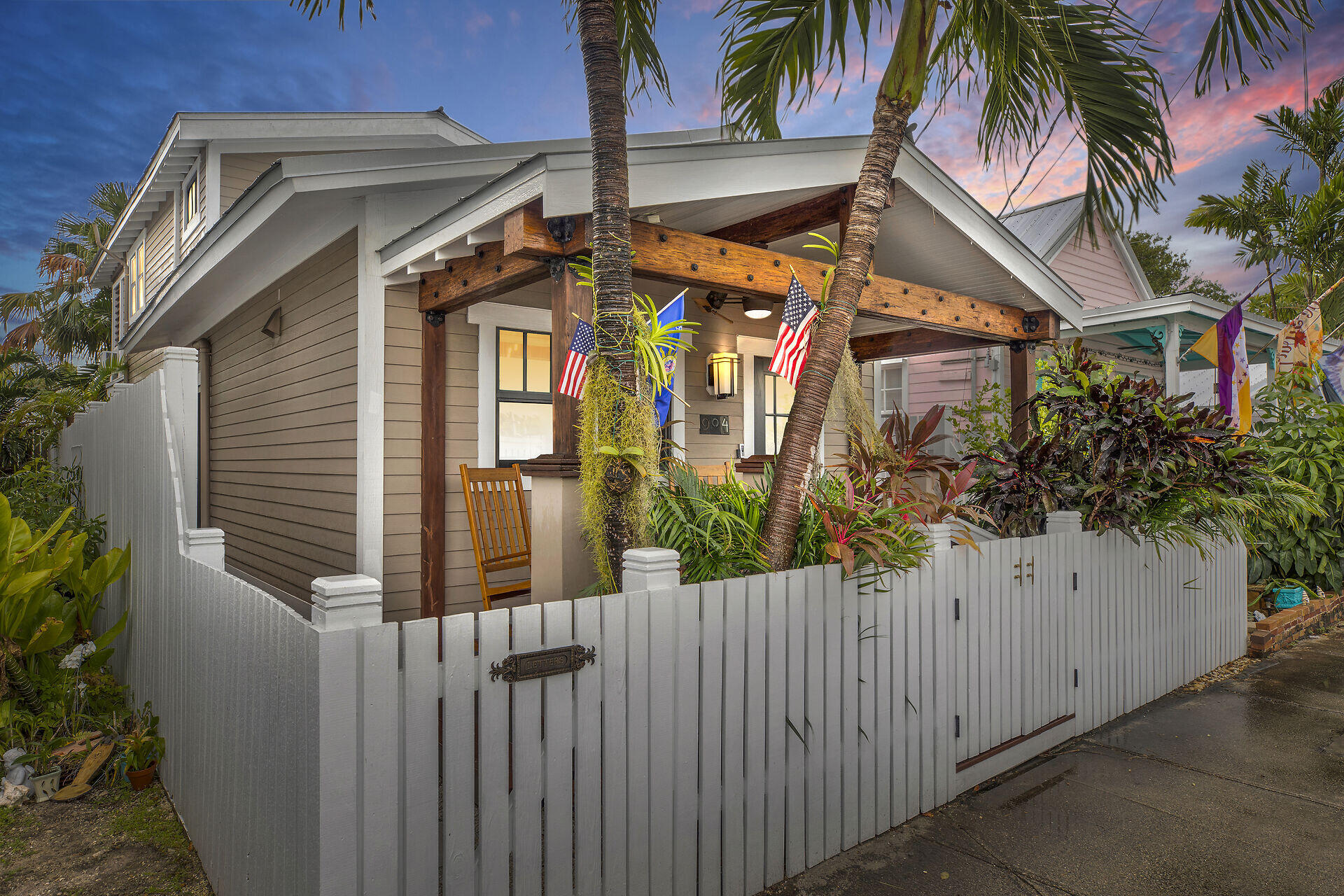 a view of a house with a small yard and plants