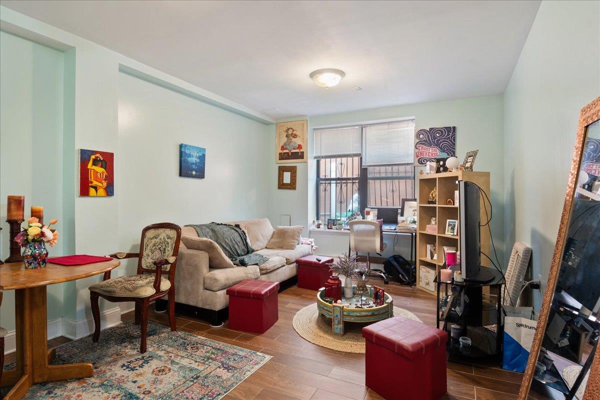 a living room with furniture workspace and a window