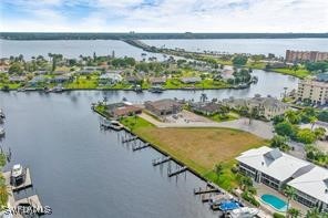 an aerial view of a house with a lake view