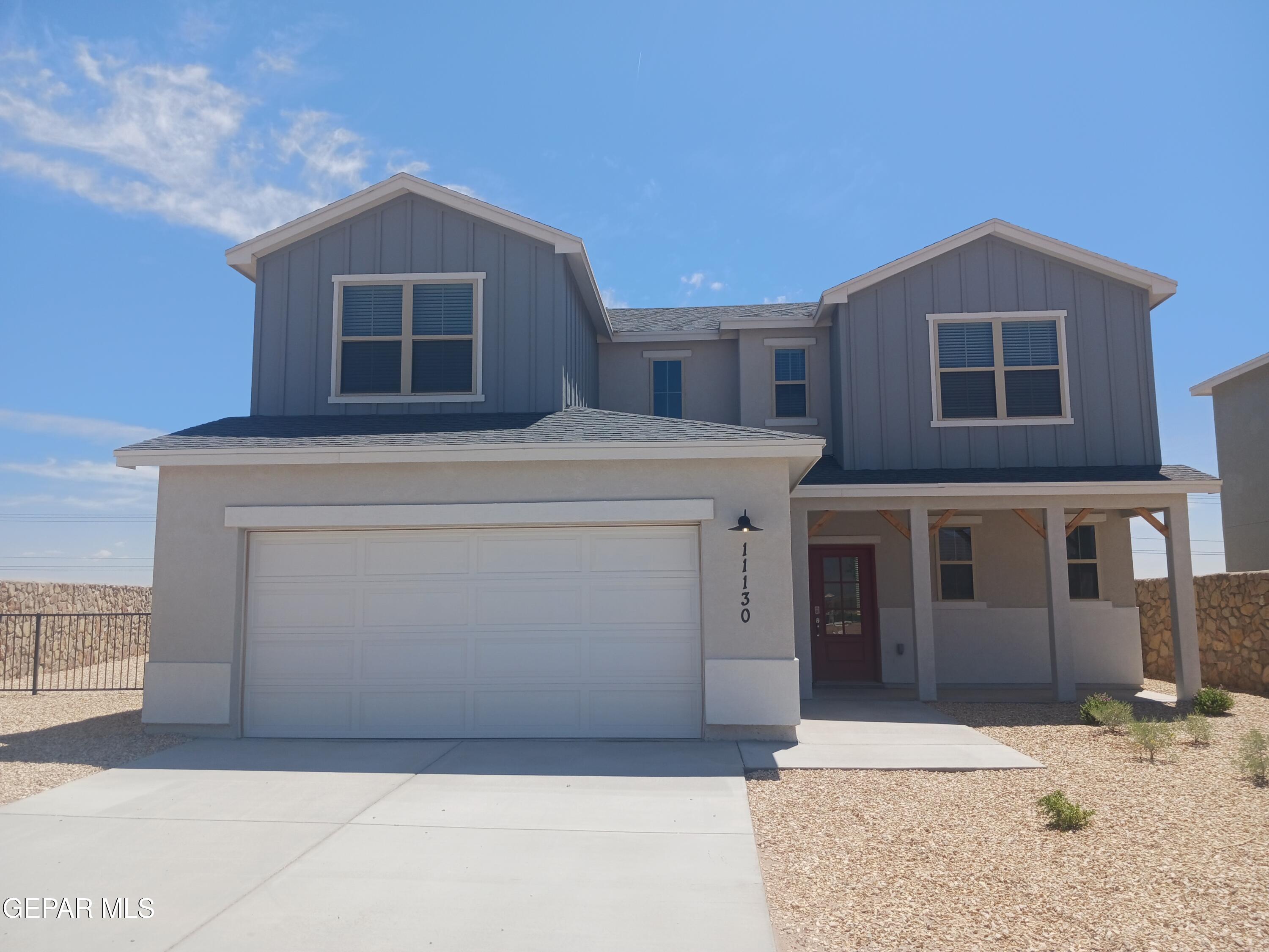 a front view of a house with a garage