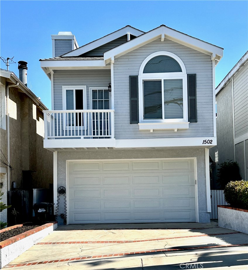 a front view of a house with a balcony