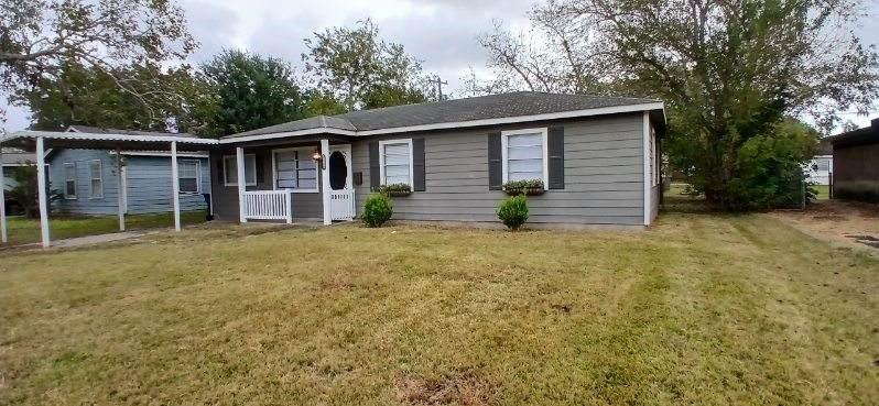 front view of a house with a yard