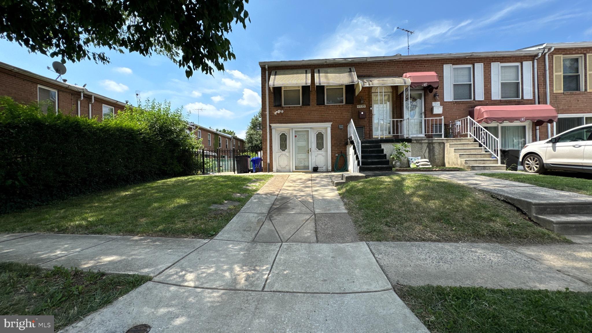 a front view of building with yard